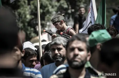 Palestinian demonstrators attend a rally in support of the Hamas movement in downtown Gaza City on August 07, 2014, while diplomatic efforts entered a final countdown in Cairo as Egyptian mediators rushed to broker an ex...