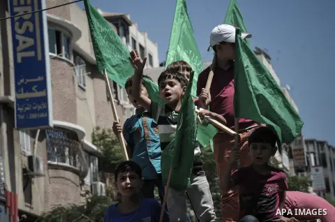 Palestinian demonstrators attend a rally in support of the Hamas movement in downtown Gaza City on August 07, 2014, while diplomatic efforts entered a final countdown in Cairo as Egyptian mediators rushed to broker an ex...