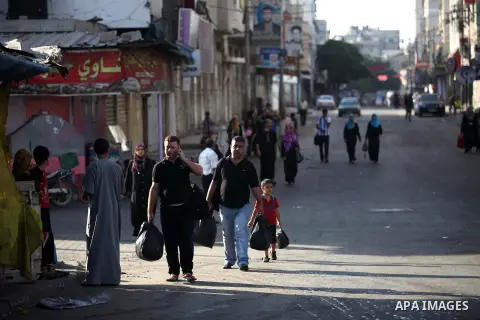 Palestinian families leave their homes in Gaza City's Shejaiya neighborhood in fear of Israeli attacks, after Palestinian factions in Gaza refused to extend the 72-hour ceasefire with Israel, on August 8, 2014. Militants...