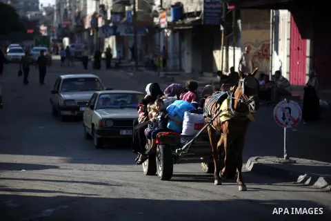 Palestinian families leave their homes in Gaza City's Shejaiya neighborhood in fear of Israeli attacks, after Palestinian factions in Gaza refused to extend the 72-hour ceasefire with Israel, on August 8, 2014. Militants...
