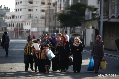 Palestinian families leave their homes in Gaza City's Shejaiya neighborhood in fear of Israeli attacks, after Palestinian factions in Gaza refused to extend the 72-hour ceasefire with Israel, on August 8, 2014. Militants...