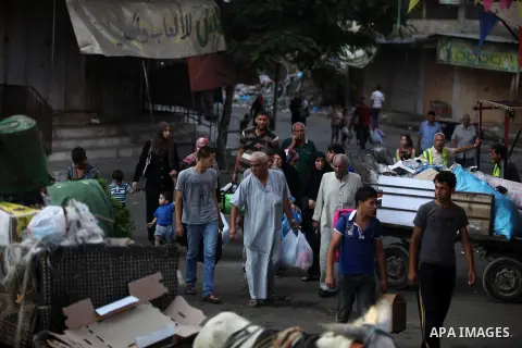 Palestinian families leave their homes in Gaza City's Shejaiya neighborhood in fear of Israeli attacks, after Palestinian factions in Gaza refused to extend the 72-hour ceasefire with Israel, on August 8, 2014. Militants...