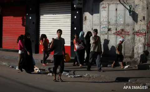 Palestinian families leave their homes in Gaza City's Shejaiya neighborhood in fear of Israeli attacks, after Palestinian factions in Gaza refused to extend the 72-hour ceasefire with Israel, on August 8, 2014. Militants...