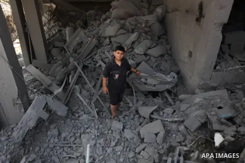 Palestinians inspect the remains of their houses, which witnesses said was hit by an Israeli air strike in Jabalia refugee camp in the northern Gaza Strip on August 9, 2014. Israel launched more than 20 aerial attacks in...