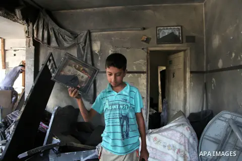 Palestinian children inspect a damaged house was hit by an Israeli military strike in Gaza City on August 10, 2014. A senior Hamas official said there was a "weak" possibility that Gaza truce talks would succeed and that...