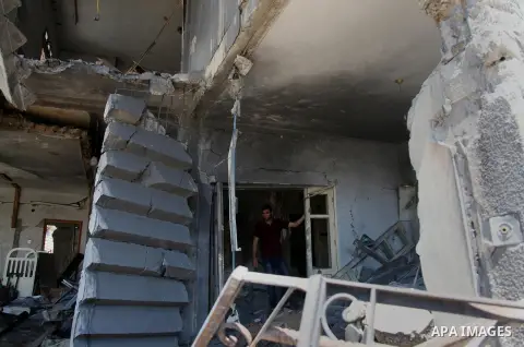 Palestinians inspect a damaged house was hit by an Israeli military strike in Gaza City on August 10, 2014. A senior Hamas official said there was a "weak" possibility that Gaza truce talks would succeed and that Palesti...