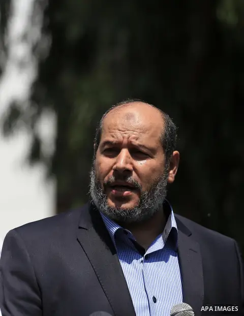 Senior Hamas leader Khalil al-Hayya speaks to the media upon his return to Gaza City from truce talks in Cairo, in Gaza city on August 14, 2014. A renewed truce between Israel and Palestinians appeared to be holding on T...