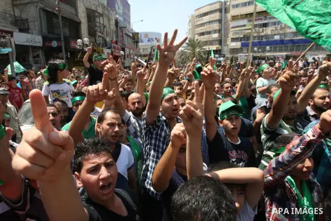Palestinian protesters wave Islamist flags as they take part in a demonstration is support of Gaza after Friday prayers in the West Bank city of Nablus August 15, 2014. Two successive truces since Monday, expected to las...