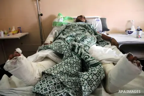 A Palestinian man, who medics said was wounded during the Israeli offensive, lies on a bed at the Red Crescent hospital, Cairo, Egypt on August 15, 2014. Two successive truces since Monday, expected to last through Augus...