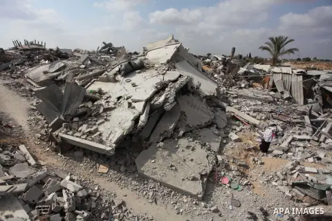 A Palestinian woman stands at the remains of her house which witnesses said was destroyed during the Israeli offensive in Johr El-Deek village near the central Gaza Strip August 17, 2014. Prime Minister Benjamin Netanyah...