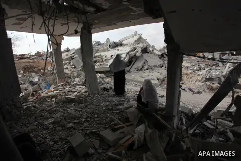 A Palestinian woman stands at the remains of her house which witnesses said was destroyed during the Israeli offensive in Johr El-Deek village near the central Gaza Strip August 17, 2014. Prime Minister Benjamin Netanyah...