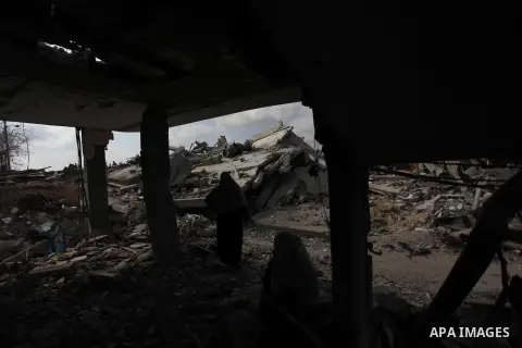 A Palestinian woman stands at the remains of her house which witnesses said was destroyed during the Israeli offensive in Johr El-Deek village near the central Gaza Strip August 17, 2014. Prime Minister Benjamin Netanyah...