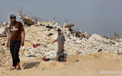 Palestinians inspect their destroyed houses, which witnesses said were damaged during the Israeli offensive, on the fourth day of a five-day ceasefire in Johr El-Deek village near the central Gaza Strip August 17, 2014....