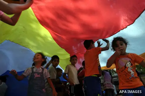 Displaced Palestinians play at a United Nations-run school sheltering displaced Palestinians from the Israeli offensive, in Gaza city August 19, 2014. The United Nations estimates about 10,000 Palestinian homes were dest...