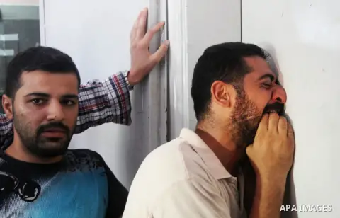 Palestinians mourn the death of their relatives Abu Nahel family's, killed in an Israeli military strike, at Gaza city's Al-Shifa hospital on August 21, 2014. Three senior Hamas commanders and four children were among at...