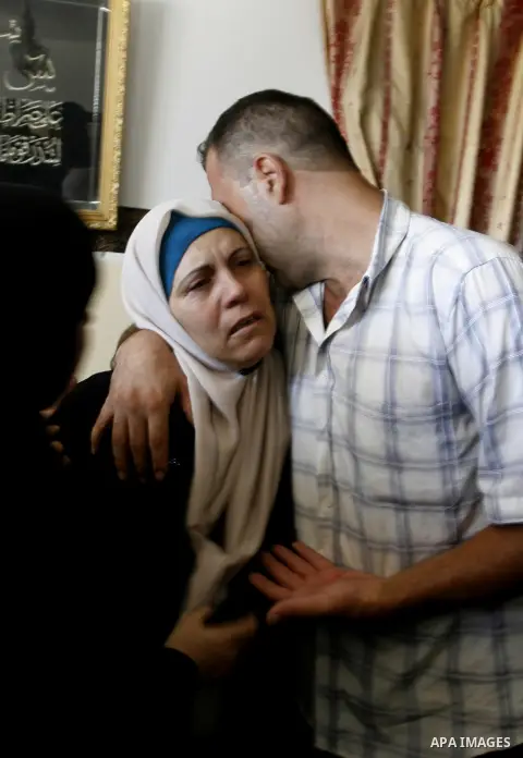 Palestinian relatives of Islamic Jihad militant Ibraheem Hammad, whom medics said was killed in an Israeli air strike, mourn during his funeral in Rafah in the southern Gaza Strip August 22, 2014. Since the collapse on T...