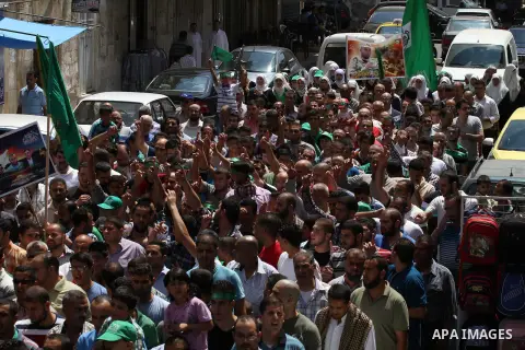 Supporters of the Palestinian Islamist Hamas movement gather during a demonstration in the West Bank city of Nablus to support people in the Gaza Strip on August 22, 2014. Four Palestinians were killed in new Israeli air...