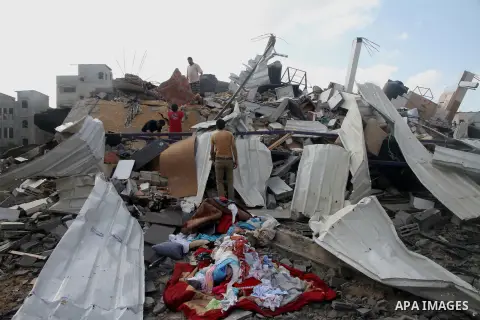 Palestinians search for their belongings amid the remains of their house, which witnesses said was destroyed in an Israeli air strike, in Gaza City August 23, 2014. Hamas-led gunmen in Gaza executed 18 Palestinians accus...
