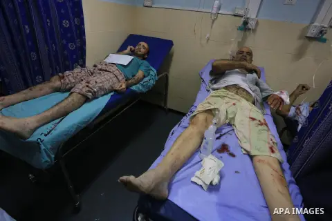 Palestinians Injured receive treatment at the emergency room of the Shifa hospital following Israeli strikes hit Gaza City, on Aug. 24, 2014. Egypt called on Israel and the Palestinians on Saturday to halt hostilities an...