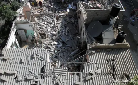 Palestinian men inspect the rubble of their house following an Israeli air strike in Deir al-Balah in the central Gaza strip on August 24, 2014. Egypt called on Israel and the Palestinians on Saturday to halt hostilities...