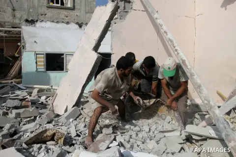 Palestinian men inspect the rubble of their house following an Israeli air strike in Deir al-Balah in the central Gaza strip on August 24, 2014. Egypt called on Israel and the Palestinians on Saturday to halt hostilities...