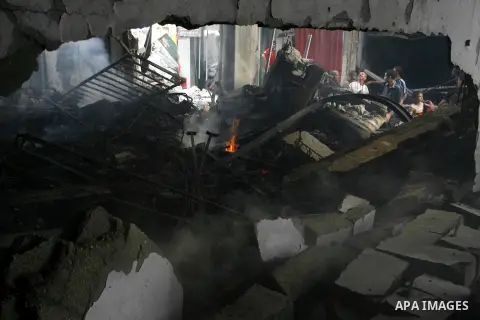 Smoke rises as Palestinians inspect their houses, which witnesses said were damaged by an Israeli air strike, in Rafah in the southern Gaza Strip August 24, 2014. Egypt called on Israel and the Palestinians on Saturday t...