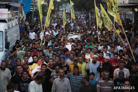 Mourners carry the body of one of four Palestinians from the Juda family, whom medics said were killed in an Israeli air strike, during their funeral in Jabaliya in the northern Gaza Strip August 24, 2014. Israeli Prime...