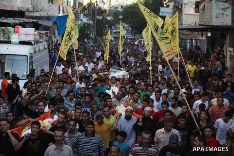 Mourners carry the body of one of four Palestinians from the Juda family, whom medics said were killed in an Israeli air strike, during their funeral in Jabaliya in the northern Gaza Strip August 24, 2014. Israeli Prime...