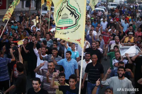 Mourners carry the body of one of four Palestinians from the Juda family, whom medics said were killed in an Israeli air strike, during their funeral in Jabaliya in the northern Gaza Strip August 24, 2014. Israeli Prime...