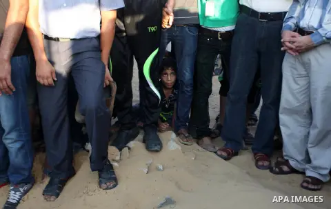 Mourners carry the body of one of four Palestinians from the Juda family, whom medics said were killed in an Israeli air strike, during their funeral in Jabaliya in the northern Gaza Strip August 24, 2014. Israeli Prime...