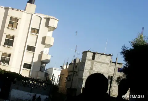 A missile which witnesses said was fired by an Israeli aircraft is seen as it targets the house of Palestinian senior Islamic Jihad leader Nafez Azzam in Rafah, in the southern Gaza Strip August 26, 2014. A Gaza ceasefir...