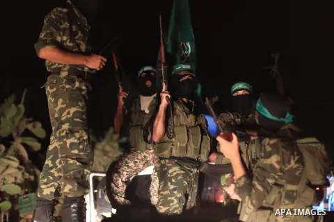 Palestinian Hamas militants hold their weapons as they celebrate with people what they said was a victory over Israel, following a ceasefire in Gaza City August 26, 2014. A ceasefire agreement between Israel and the Pale...