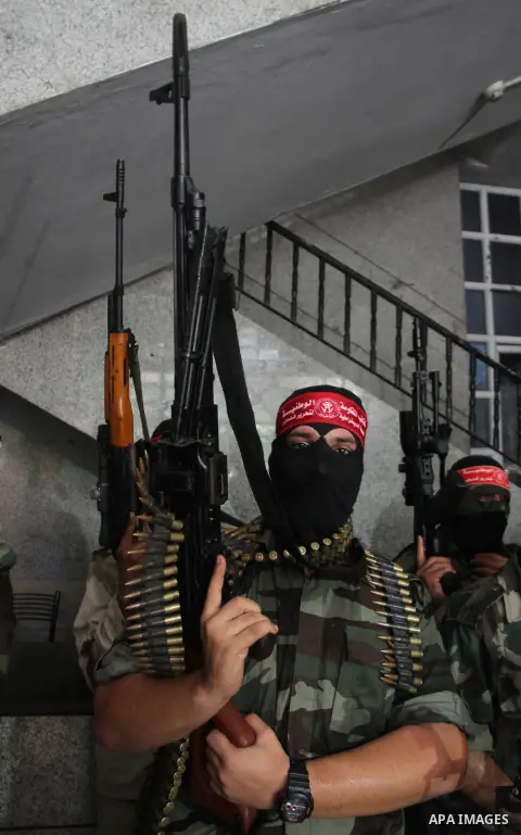 Palestinian Militants from the Democratic Front for the Liberation of Palestine (DFLP) attend a press conference in Gaza city on August 27, 2014. Palestinian President Mahmoud Abbas announced on 26 August 2014 an Egyptia...