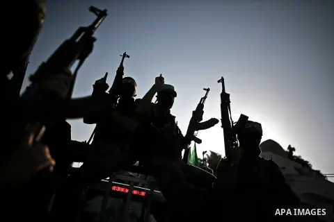 Palestinian militants from the Ezzedine al-Qassam Brigades, Hamas' armed wing, attend a rally in Gaza City on August 27, 2014, following a deal hailed by Israel and the Islamist movement as 'victory' in the 50-day war. T...