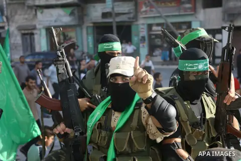Palestinian militants from the Ezzedine al-Qassam Brigades, Hamas' armed wing, take part in a rally in Gaza City on August 27, 2014, following a deal hailed by Israel and the Islamist movement as 'victory' in the 50-day...