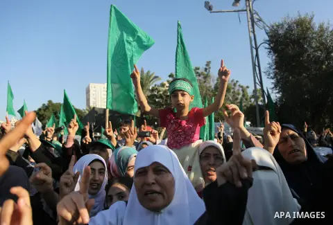 Palestinians Hamas supporters celebrate with people a victory over Israel, in Gaza City August 27, 2014. An open-ended ceasefire in the Gaza war held on Wednesday as Prime Minister Benjamin Netanyahu faced strong critici...