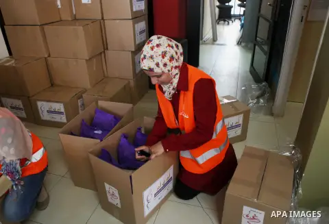 Palestinians collect human supplies to be sent to the stricken in the Gaza Strip in the West Bank city of Ramallah on August 28, 2014. Israel and Palestinians both boasted of victory in the Gaza war but analysts say Hama...