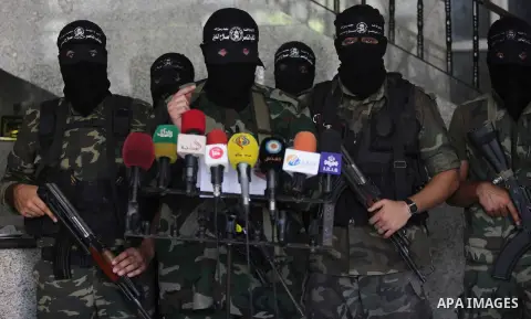 Palestinian Militants from al-Nasser Salah el dein brigades attend a press conference in Gaza city on August 28, 2014. An open-ended ceasefire in the Gaza war held on Wednesday as Prime Minister Benjamin Netanyahu faced...