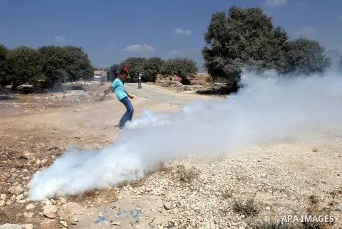 Palestinian protestors clash with Israeli security forces in the village of Bilin, near the West Bank city of Ramallah following a march in support of the resistance in the Gaza Strip on August 29, 2014. Seven weeks of w...