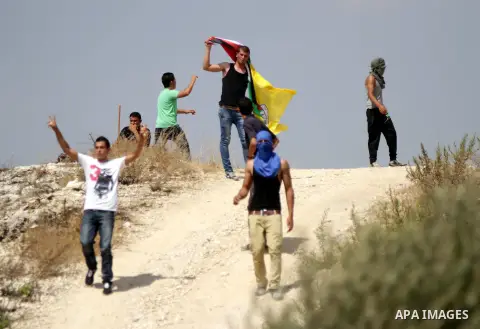 Palestinian protestors clash with Israeli security forces in the village of Bilin, near the West Bank city of Ramallah following a march in support of the resistance in the Gaza Strip on August 29, 2014. Seven weeks of w...