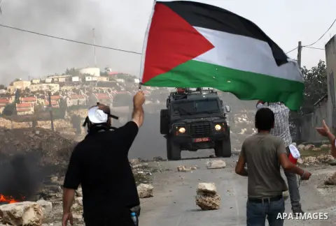 Palestinian protestors clash with Israeli soldiers near the Jewish settlement of Qadomem at Kofr Qadom village, near West Bank city of Nablus, 29 August 2014. Photo by Nedal Eshtayah