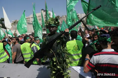 Palestinian boys hold a mock rocket during a rally following the Friday prayers, three days after a deal hailed by Israel and Hamas as 'victory' in the 50-day war on August 29, 2014 in the West Bank town of Hebron. Thous...