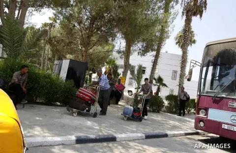 Palestinians wait to be given the permission to cross into Egypt at the Rafah border crossing in the southern Gaza Strip, on August 28, 2014. The Rafah crossing with Egypt is Gaza's only gateway to the world that is not...