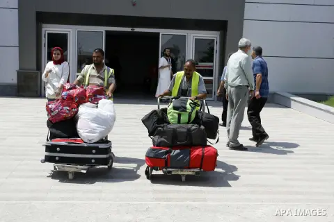 Palestinians wait to be given the permission to cross into Egypt at the Rafah border crossing in the southern Gaza Strip, on August 28, 2014. The Rafah crossing with Egypt is Gaza's only gateway to the world that is not...