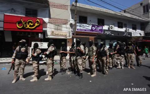 Palestinian Islamic Jihad militants take part in a rally celebrating what they say was a victory over Israel following a ceasefire in Gaza City August 29, 2014. An open-ended ceasefire, mediated by Egypt, took effect on...