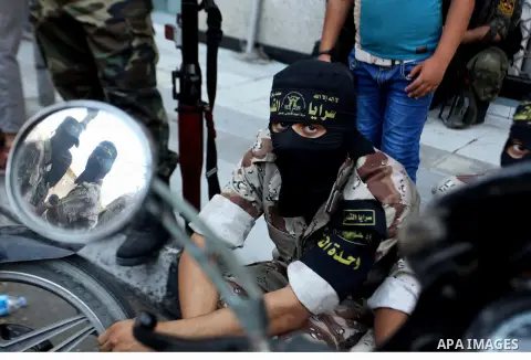Palestinian Islamic Jihad militants take part in a rally celebrating what they say was a victory over Israel following a ceasefire in Gaza City August 29, 2014. An open-ended ceasefire, mediated by Egypt, took effect on...