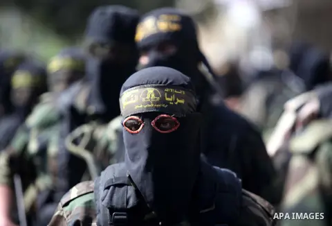 Palestinian Islamic Jihad militants take part in a rally celebrating what they say was a victory over Israel following a ceasefire in Gaza City August 29, 2014. An open-ended ceasefire, mediated by Egypt, took effect on...