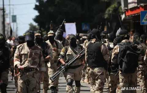 Palestinian Islamic Jihad supporters celebrate with people what they said was a victory over Israel, in Gaza City August 29, 2014. An open-ended ceasefire, mediated by Egypt, took effect on Tuesday evening. It called for...