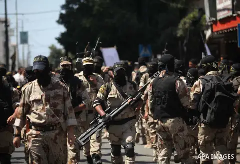 Palestinian Islamic Jihad supporters celebrate with people what they said was a victory over Israel, in Gaza City August 29, 2014. An open-ended ceasefire, mediated by Egypt, took effect on Tuesday evening. It called for...