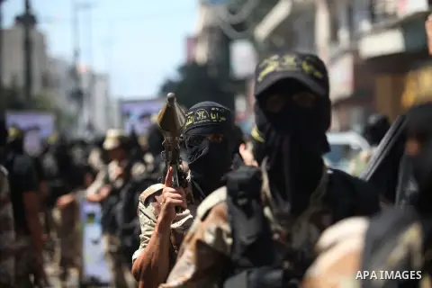 Palestinian Islamic Jihad supporters celebrate with people what they said was a victory over Israel, in Gaza City August 29, 2014. An open-ended ceasefire, mediated by Egypt, took effect on Tuesday evening. It called for...